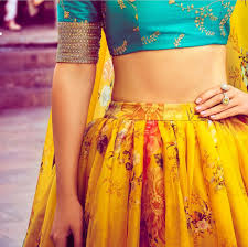 Sabyasachi The Mood Kept Light With A Beautiful Yellow Lehenga And Turquoise Blouse Contrasting The Former Sabyasachi Fashion Indian Designer Wear