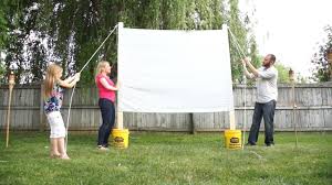 Fill your buckets with sand or wet cement. Outdoor Movie Projector Screen Diy Valu Home Centers For The Do It Yourselfer In You