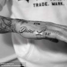 Divine Love On Lewis Hamilton Hamilton Tattoos Fear Tattoo Hand Tattoos