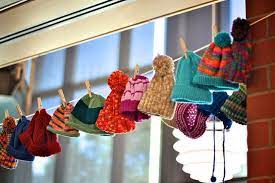 Knitted Hats On Display At The Ppl Yarn Store Display Ideas Yarn Display Craft Fair Displays