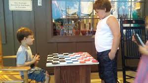 There are 14 pegs that are placed in a triangle made of 15 holes. Kids Playing Giant Checkers Outside Of Cracker Barrel Picture Of Cracker Barrel Altoona Tripadvisor