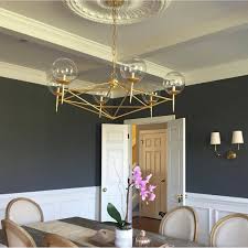 These lamps can be placed in nearly any space and are available in gold, silver leafing, nickel, and other finishes. Worlds Away Rowan Chandelier Aptdeco