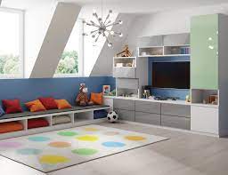 Uniform, boxy shelving units can overpower a small room and make it feel smaller than it really is. Family Room Cabinets Storage Solutions California Closets