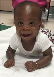 c Prone at 7 months of age, better stability, more mature base of support