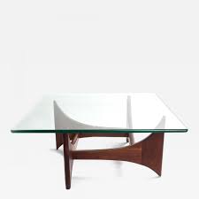 The table could be upside down with the rubber dots currently hidden under the feet. Adrian Pearsall Adrian Pearsall Walnut And Glass Cocktail Table