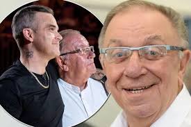 Robbie Williams rallies round his singer dad 'after splitting from his wife  after eight years'