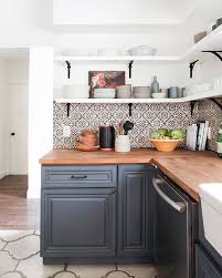 Black And White Spanish Tile Backsplash Before And After Modern Spanish Kitchen Kitchen Flooring Home Kitchens Kitchen Design