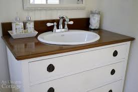 We've had so much interest in our new bathroom vanity since posting about our bathroom renovation earlier this year. How To Make A Dresser Into A Vanity Tutorial An Oregon Cottage