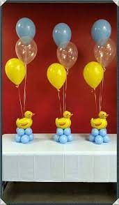 It is all assembled with ribbon and rubber bands, so no glue will render the diapers unusable. Rubber Ducky Baby Shower Theme Ideas Diy Baby Shower Decorations Baby Shower Duck Baby Shower Diy