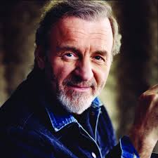 Who wrote “Country Roads” by Colm Wilkinson?
