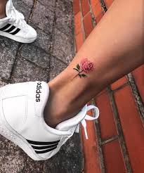 A dark piece of a flower tattoo for guys featuring the delicate rose in black and . Small Rose Tattoos 30 Beautiful Tiny Rose Tattoo Ideas