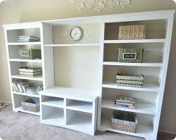 This Is Two Bookshelves And A Tv Stand Painted And Put Together To Look Like A Built In Entertainment Unit I Am Definitely Puttin Home Diy Diy Home Decor Home