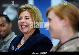 Heidi H. Grant, Deputy Under Secretary of the Air Force, International  Affairs, talks with service members during a luncheon at the Dubai Airshow  Nov. 14, 2017. Grant provides oversight and guidance for