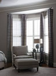 A Way To Dress Bay Windows Wood Shutters Floor To Ceiling Curtains Curtains Living Room Bay Window Treatments Home