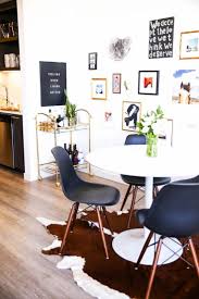 Black Eames Chairs White Tulip Table Cait Weingartner S Home Tour Eameschair Living Room Decor On A Budget Trendy Living Rooms Black Eames Chair