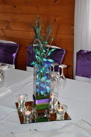 Singapore Orchid Peacock Feather Wedding Table Centerpiece Feather Centerpiece Wedding Wedding Centerpieces Flower Centerpieces Wedding