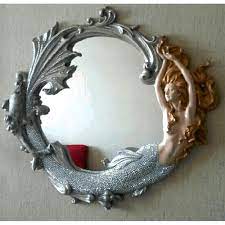 This beautiful legendary sea creature is made from hand tooled pewter, she is pictured surrounded by. Mermaid And Seashell Mirror Options Compact Hand And Wall Mirrors