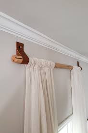 Diy Wood Curtain Rods With Leather Straps For Under 10 Dani Koch Wood Curtain Rods Wood Curtain Diy Curtain Rods