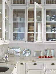 A Mediterranean Revival Home In Miami Beach Luxe Interiors Design In 2021 Glass Kitchen Cabinet Doors Glass Kitchen Cabinets Glass Cabinet Doors