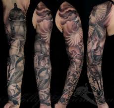 Black and grey angel with flying birds and rose tattoo on man left full sleeve. Arm And Leg Sleeve Tattoos Always Forever Tattoo Studio Tattoos By Holly Azzara