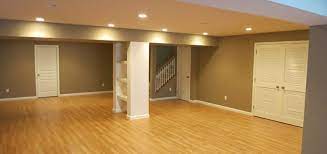 This expansive finished basement features lightly colored carpeting and recessed lighting throughout. 4 Benefits Of A Finished Basement Zephyr Thomas Home Improvement