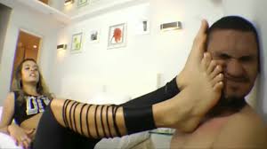 Incredibly sexy mistress slaps her Asian male slave with her hot feet