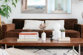 The coffee table set features two tables that can be joined to form a single coffee table or detached to create more space while entertaining guests. 15 Pretty Ways To Decorate And Style A Coffee Table