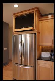 It's okay to wine a little. Kitchen Cabinet Above Refrigerator Space Tv Tv In Kitchen Kitchen Kitchen Design