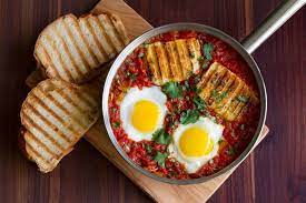 Spicy Baked Eggs With Halloumi Harissa Cooking With Cocktail Rings Halloumi Baked Eggs Diet Soup Recipes