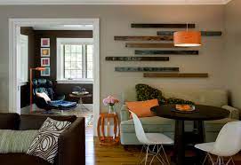 You may want to consider using a loveseat in place of a full couch. Cozy Up To A Loveseat At The Table
