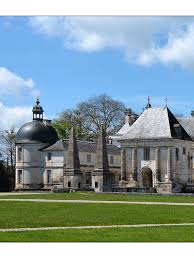 The walls are of limestone under tall sloping slate roofs à la française, surrounding three sides of a central court with cylindrical towers at. Chateau De Tanlay Sur La Route Des Chateteaux De Bourgogne