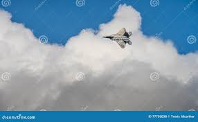 F-22 Raptor in the clouds stock photo. Image of view