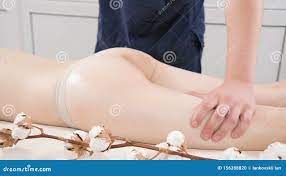Close-up of a Male Physiotherapist Rubbing Massage Oil on the Thigh and  Buttocks of Woman before Massage Treatments in a Stock Footage - Video of  lying, beauty: 156288820