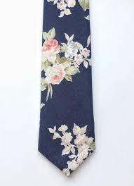 Dark solid colored suits, especially grey and navy blue, go well with most tie color combinations by default. Floral Tie Navy Blue Skinny Tie Pink Floral Tie Mens Skinny Tie Wedding Tie Men S Floral Tie Rose Print Tie Floral Tie Wedding Mens Wedding Ties Mens Floral Tie