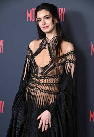 Anne Hathaway Makes a Statement in a Gothic Nude Illusion Dress With Whimsical Sleeves and an Unexpected Shoe