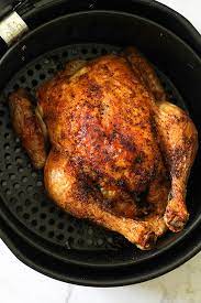 Place the chicken in the air fryer basket, breast side down. Air Fryer Whole Chicken Whole30 Paleo Cook It Real Good