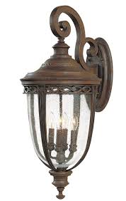 This wall sconce features an elongated shape in a robust metal construction with a weathered zinc finish. Feiss English Bridle 4 Light Extra Large Outdoor Wall Lantern British Bronze