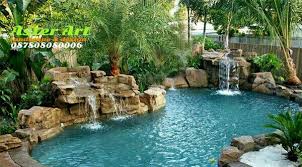 Selain air mancur, desain kolam ikan minimalis lainnya yang bisa diterapkan untuk menciptakan gemericik air yang menenangkan adalah membentuk air terjun mini di kolam ikan. Tukang Kolam Jakarta Kolam Air Macur Batu Alam Kolam Tebing Air Terjun Batu Buatan Kolam Ikan Koi Des Luar Ruangan Pertamanan Belakang Rumah Desain Lanskap