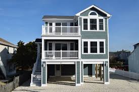 This angled and contemporary house plan is a popular design. Why We Build Reverse Living Custom Home Designs On Lbi