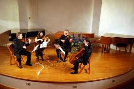 A long piece of music for an orchestra, usually with four movements (= parts): String Quartet Wikipedia