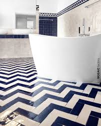 Bathroom Floor With Blue And White Herringbone Tile Pattern In Zellige Handmade Moroccan Tiles From White Herringbone Tile Herringbone Tile White Tile Floor