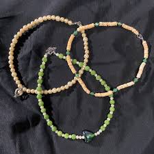 Keeping in mind that the finished length of your necklace will be about 14 inches long, you'll string about seven inches of your necklace and then you'll add your charm which we want in the middle of the necklace, and then string the rest of our beads. Indie Aesthetic Handmade Pearl Choker Necklaces Vintage Beads Women S Fashion Jewelry Organizers Necklaces On Carousell