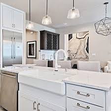 Related:white kitchen faucet with sprayer white pull out kitchen faucet moen kitchen faucet white. The Solna Pull Down Kitchen Faucet In Matte White Completes A Bold Monochromatic White Kitchen Space By Dyprop Kitchen Faucet All White Kitchen White Kitchen