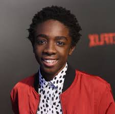 Black And White Hairstyles 2020 Caleb Mclaughlin Black White Shirt Red Jacket Black Curly Hair Boys Short Haircuts Black Background In 2020 Stranger Things Actors Cast Stranger Things Stranger Things