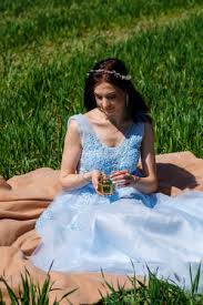 The night machines out june 3rd, 2016. A Young Woman In A Blue Long Dress Sits Against A Green Field Stock Photo Picture And Royalty Free Image Image 159990605