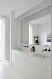 In general, leave about 6 inches of space from the top of the vanity mirror to the ceiling, and choose a design that is 1 or 2 inches narrower than your sink for a pleasing. Big Bathroom Mirror Trend In Real Interiors