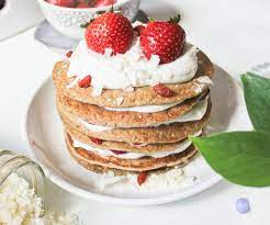 In a saucepan over medium heat, add the quartered strawberries, water, and sugar. Strawberry Shortcake Pancakes With Coconut Whipped Cream Vegan One Green Planet