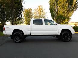 A suspension lift kit is used to increase the ground clearance between the vehicle and the ground. 2010 Toyota Tacoma V6 Double Cab Trd Sport Long Bed Lifted