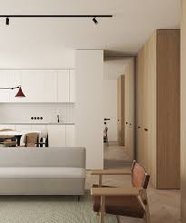 Sleek Open Plan Kitchen With Long Arm Wall Lamp Apartment Interior Scandinavian Interior Design Home Interior Design