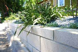 A retaining wall slope secured with blocks. A Diy Cinder Block Retaining Wall Project